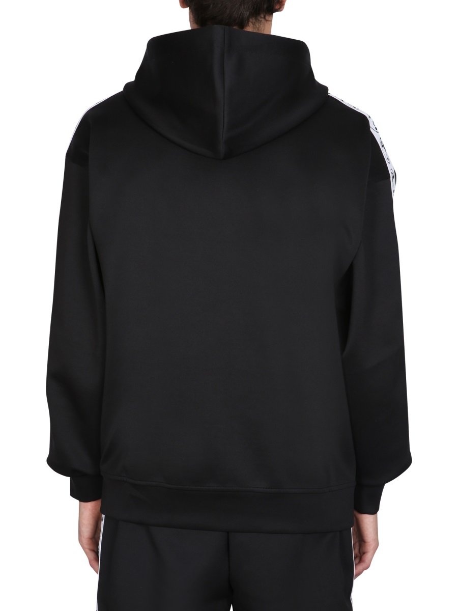 Moschino Logo Printed Drawstring Zipped Hoodie 3 Moschino Logo Printed Drawstring Zipped Hoodie